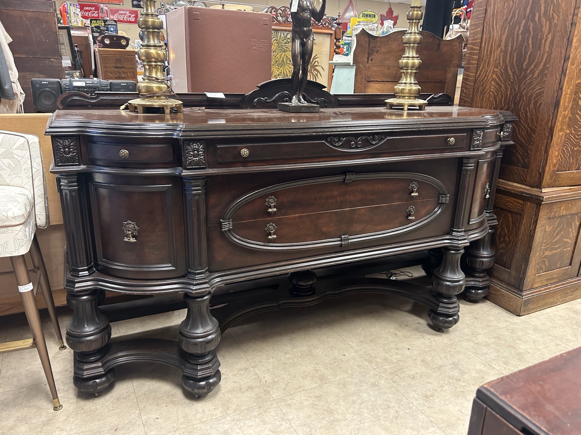 Antique wooden furniture and cabinets at Krave Antiques store in Regina