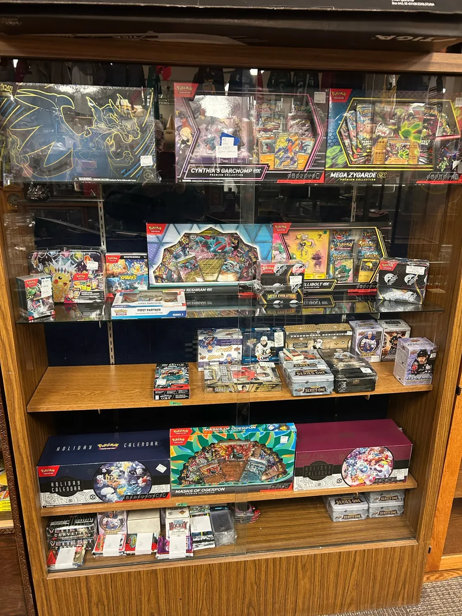Pokemon and sports card display case at Krave Antiques Regina