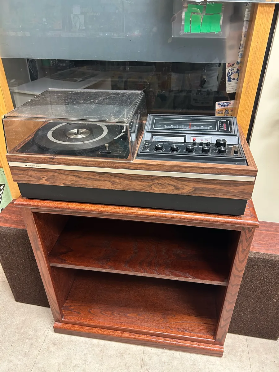 Vintage wood-cased stereo and record player console at Krave Antiques Regina
